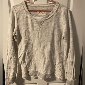 Unique sweatshirt with lace insets.